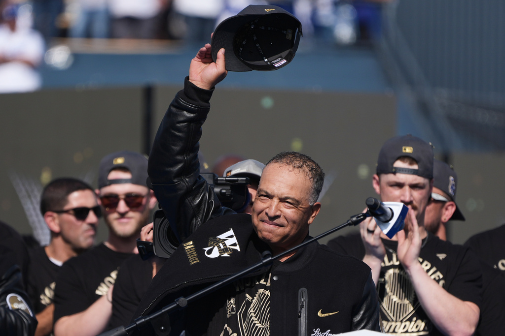 Los Angeles Dodgers manager Dave Roberts tips his cap during a celebration of the baseball team's World Series win at Dodger Stadium on Monday, Nov. 3, 2025, in Los Angeles. (AP Photo/Gregory Bull)