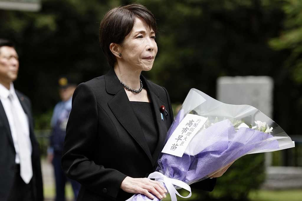 Japan’s Prime Minister Sanae Takaichi lays flowers during her visit to the Chidorigafuchi National Cemetery as the country marks the 81st anniversary of its surrender in the World War II, in Tokyo, Saturday, Aug. 15, 2026. (Juntaro Yokoyama/Kyodo News via AP)