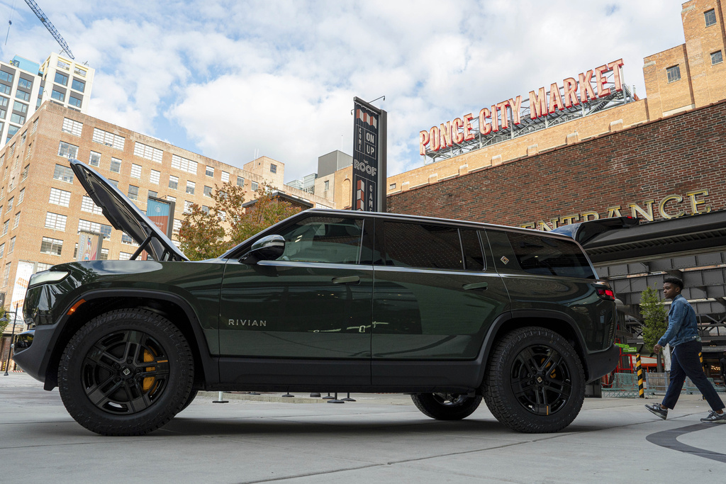FILE - A Rivian R1S is displayed outside of the auto manufacturer's new space at Ponce City Market on Oct. 19, 2023, in Atlanta. (Matthew Pearson/WABE via AP, File)