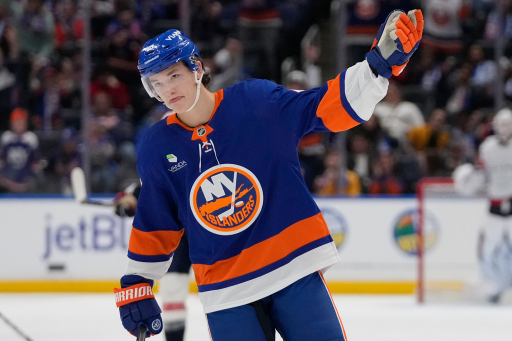 FILE - New York Islanders' Matthew Schaefer (48) celebrates after a goal he scored was reviewed during the third period of an NHL hockey game against the Washington Capitals, Oct. 11, 2025, in Elmont, N.Y. (AP Photo/Frank Franklin II, file)