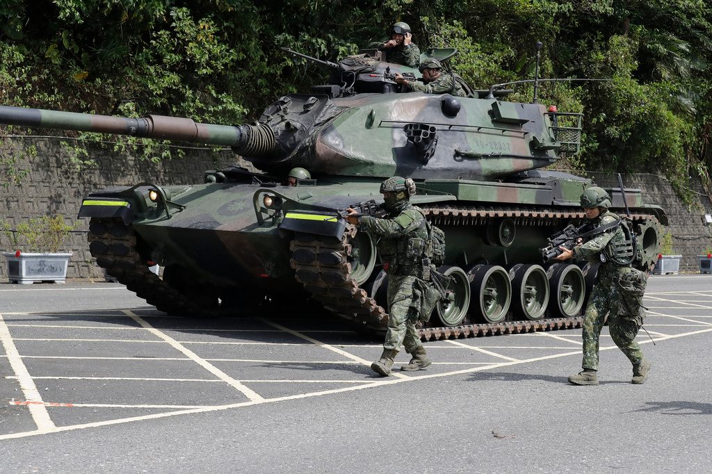 Soldiers participate in the annual Han Kuang military exercises in Yilan, northeastern Taiwan, Monday, Aug. 10, 2026. (AP Photo/Chiang Ying-ying, Pool)