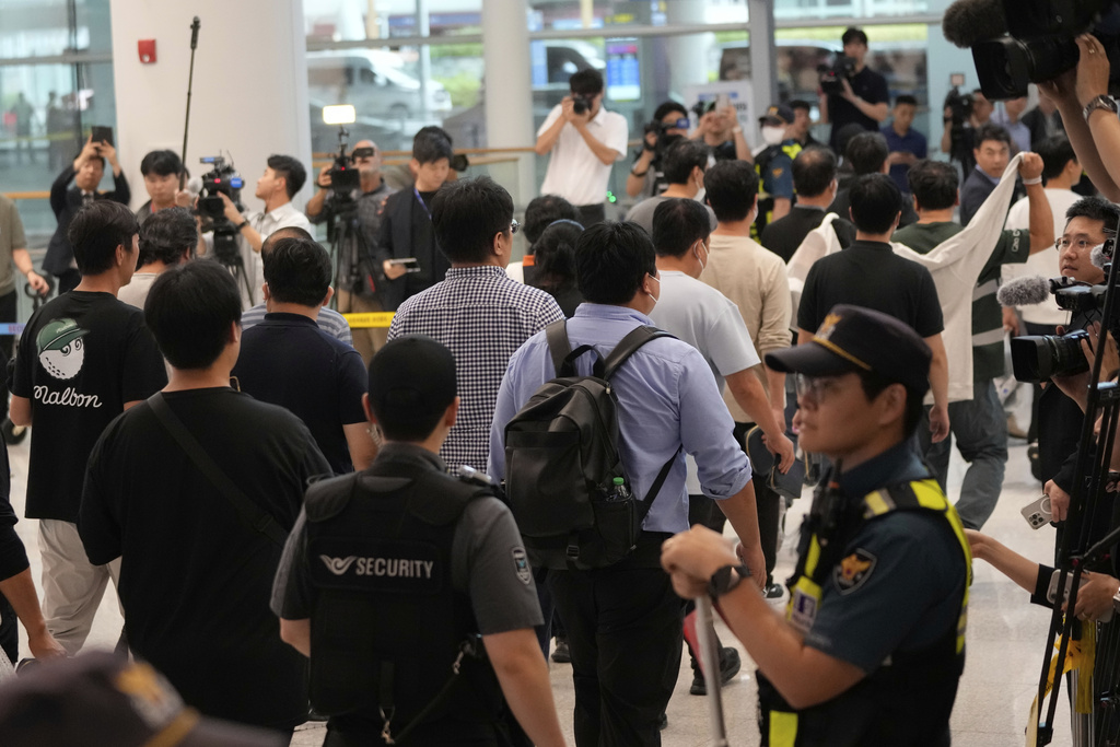 South Korean workers released after days of detention in Georgia arrive at the Incheon International Airport, in Incheon, South Korea, Friday, Sept. 12, 2025. (AP Photo/Ahn Young-joon)