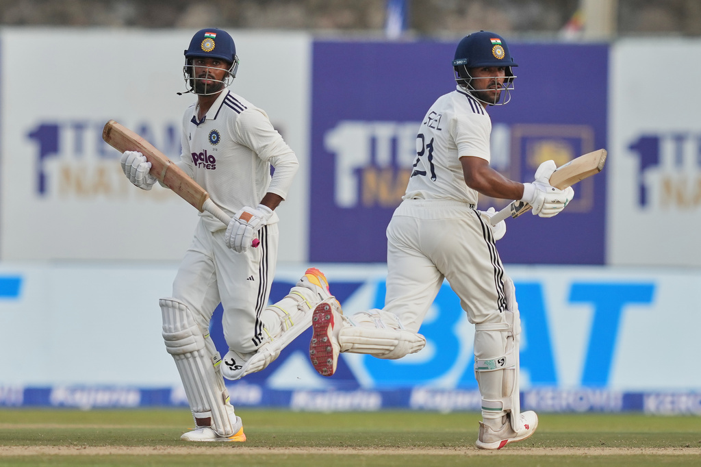 India's Dhruv Jurel, right, and India's Manav Suthar run between the wickets during the second day of the first Test cricket match between Sri Lanka and India in Galle, Sri Lanka, Sunday, Aug. 16, 2026. (AP Photo/Eranga Jayawardena)
