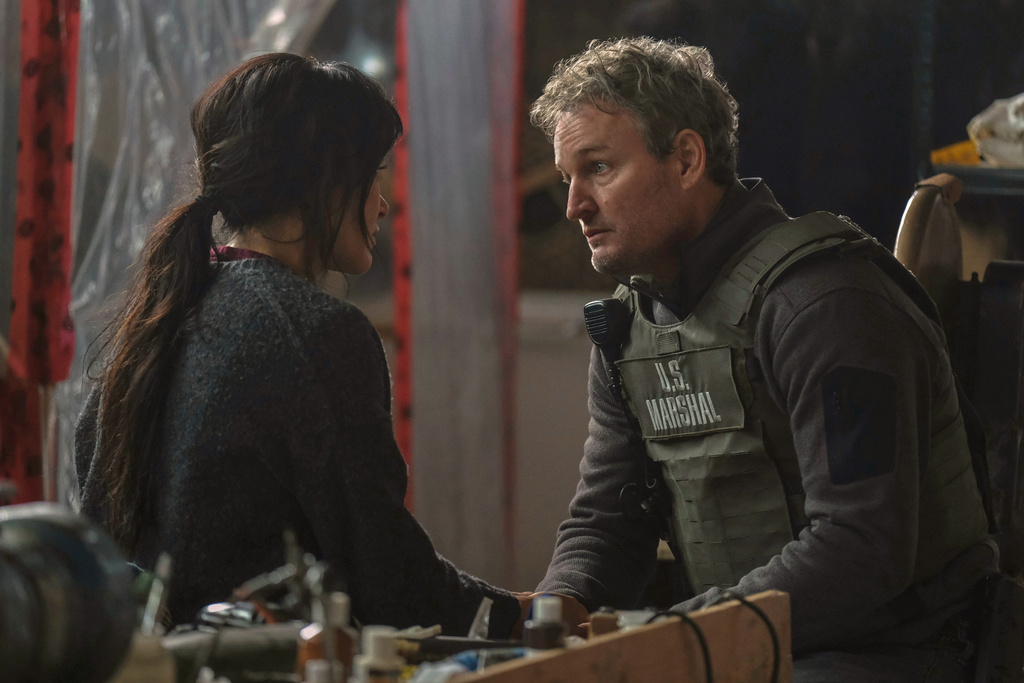 This image released by Apple TV+ shows Simone Kessell, left, and Jason Clarke a scene from "The Last Frontier." (Apple TV+ via AP)