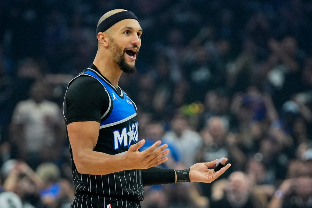 Orlando Magic guard Jalen Suggs interacts with fans after sinking a 3-point shot against the Detroit Pistons during the first half in Game 3 of a first-round NBA basketball playoff series basketball game, Saturday, April 25, 2026, in Orlando, Fla. (AP Photo/John Raoux)