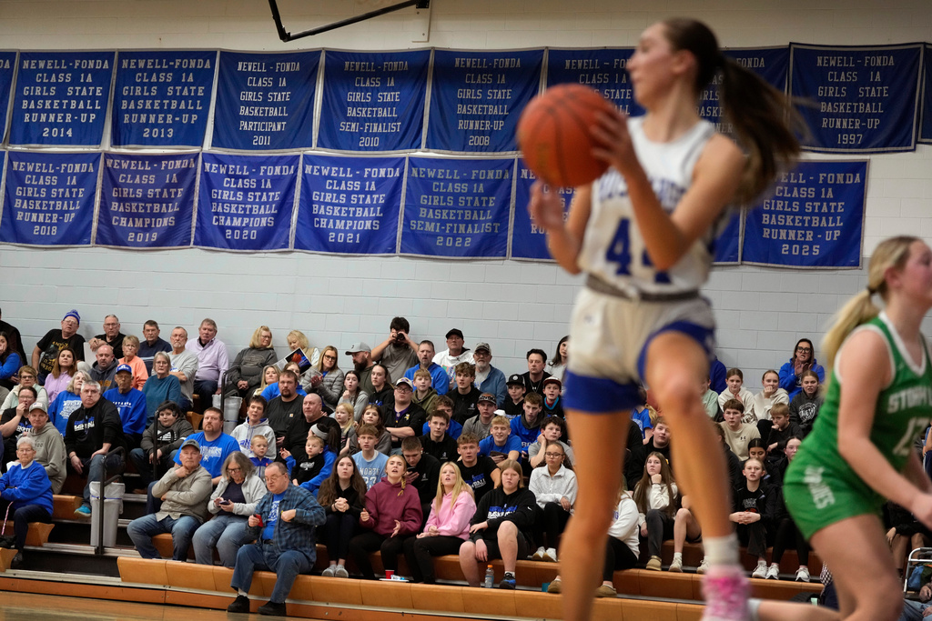 Fans watch a high school girls basketball game between Newell-Fonda and Storm Lake, Jan. 6, 2026, in Newell, Iowa. (AP Photo/Charlie Neibergall)