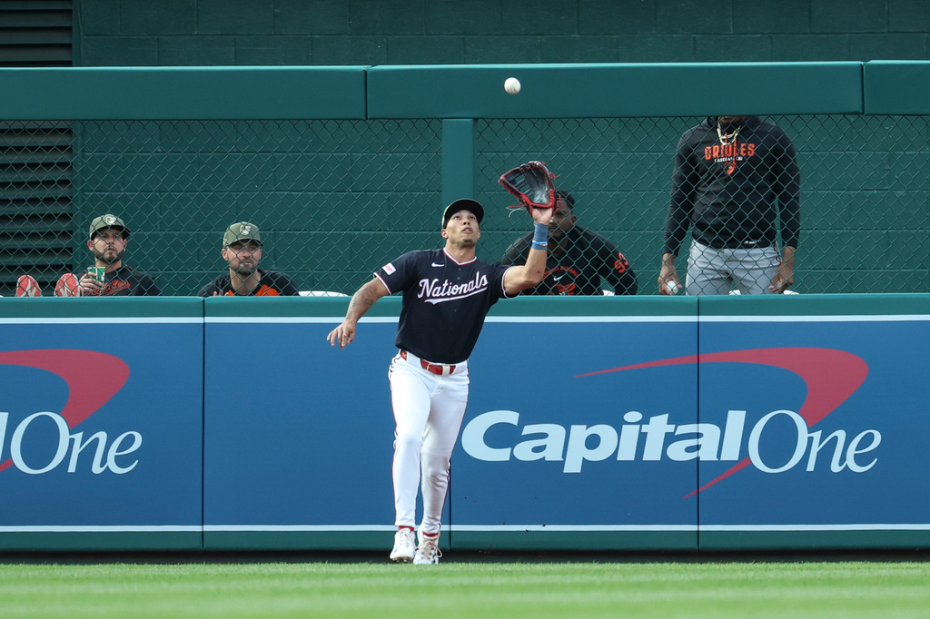 Washington Nationals left fielder Daylen Lile catches a fly ball hit by Baltimore Orioles' Tyler O'Neill off pitcher Zack Littell during the second inning of a baseball game, Friday, May 15, 2026, in Washington. (AP Photo/Terrance Williams)