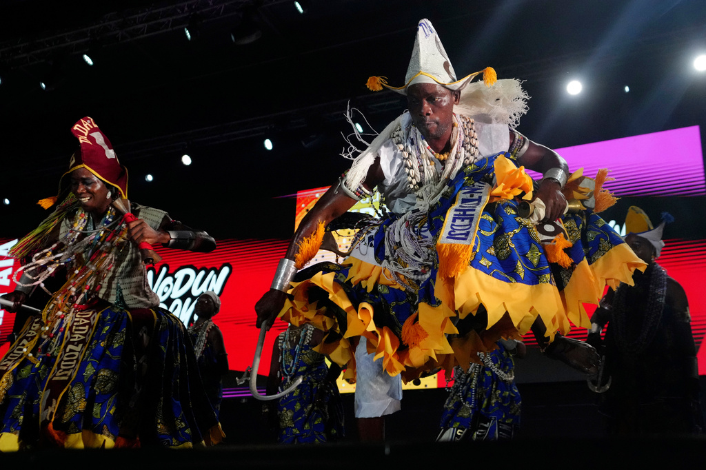FILE - Voodoo worshippers dance during the annual Voodoo Festival in Ouidah, Benin, Jan. 10, 2025. (AP Photo/Sunday Alamba, File)