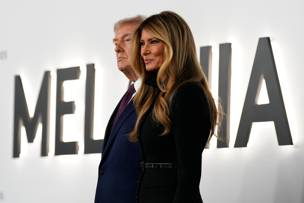 President Donald Trump and first lady Melania Trump arrive for the premiere of her movie "Melania" at The John F. Kennedy Memorial Center For The Performing Arts, Thursday, Jan. 29, 2026, in Washington. (AP Photo/Jose Luis Magana)
