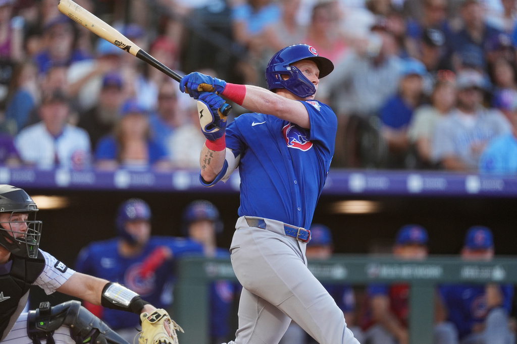 Chicago Cubs' Pete Crow-Armstrong follows the flight of his triple off Colorado Rockies starting pitcher Michael Lorenzen in the fourth inning of a baseball game Wednesday, June 10, 2026, in Denver. (AP Photo/David Zalubowski)