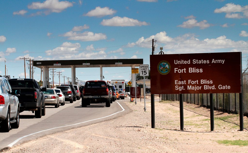 FILE - Cars wait to enter Fort Bliss, Texas, Sept. 9, 2014. (AP Photo/Juan Carlos Llorca, File)