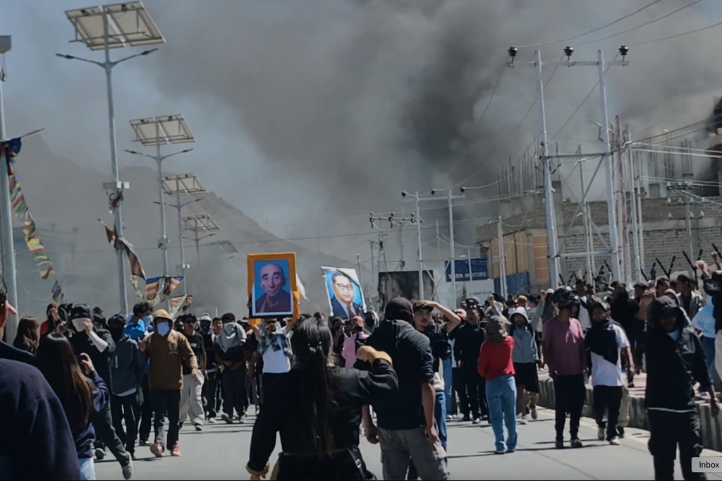 Smoke rises from buildings including the local office of India’s ruling Bharatiya Janata Party set ablaze during protests demanding greater autonomy from Indian government for the Himalayan territory in Leh town, Ladakh, India, Wednesday, Sept. 24, 2025. (AP Photo)