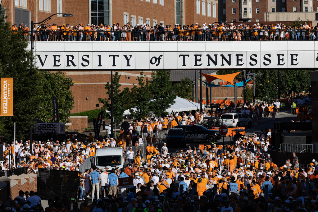 Fans watch from the bridge during the Vol Walk before an NCAA college football game between Tennessee and Texas, Saturday, Sept. 26, 2026, in Knoxville, Tenn. (AP Photo/Wade Payne)
