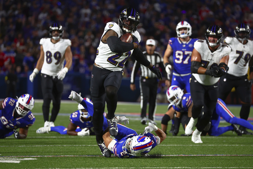 Baltimore Ravens running back Derrick Henry (22) runs for a touchdown against the Buffalo Bills during the first half of an NFL football game in Orchard Park, N.Y., Sunday, Sept. 7, 2025. (AP Photo/Jeffrey T. Barnes)