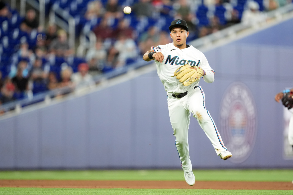 Miami Marlins third baseman Javier Sanoja makes a throw to first to get out Chicago White Sox' Chase Meidroth during the sixth inning of a baseball game, Wednesday, April 1, 2026, in Miami. (AP Photo/Rebecca Blackwell)