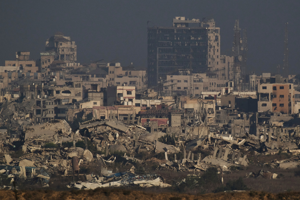 Buildings that were destroyed during the Israeli ground and air operations stand in the northern Gaza Strip as seen from southern Israel, Thursday, Sept. 11, 2025. (AP Photo/Leo Correa)