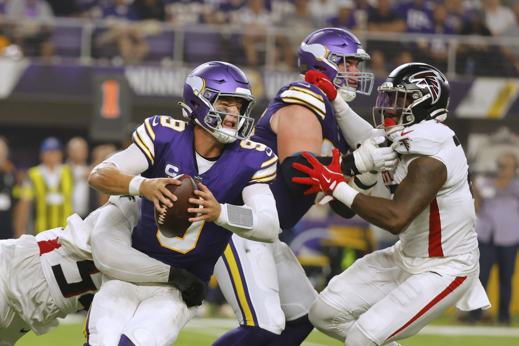 Atlanta Falcons defensive tackle Brandon Dorlus (54) sacks Minnesota Vikings quarterback J.J. McCarthy (9) during the first half of an NFL football game, Sunday, Sept. 14, 2025, in Minneapolis. (AP Photo/Bruce Kluckhohn)