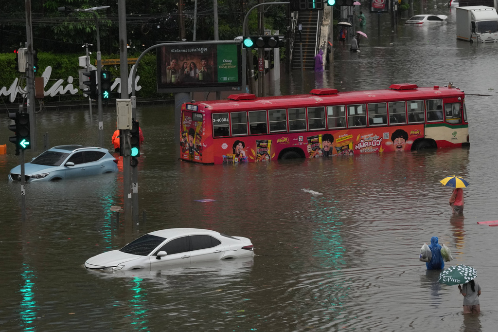 The streets are flooded after heavy rain in Bangkok, Thailand, Saturday, Sept. 26, 2026. (AP Photo/Sakchai Lalit)