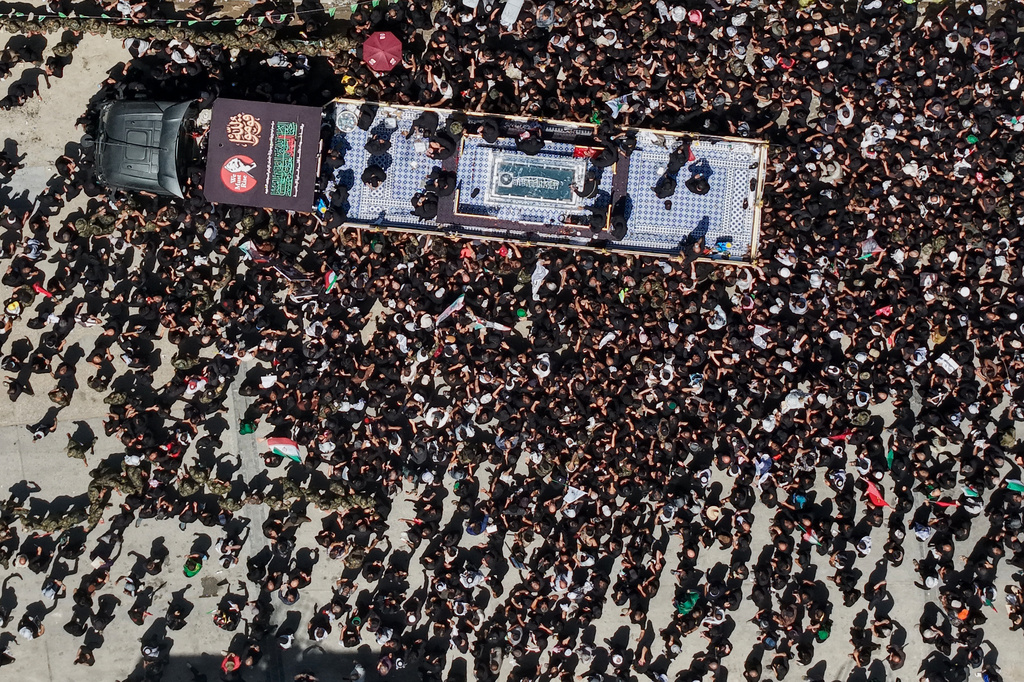 A truck carrying the coffin of the late Iranian Supreme Leader Ayatollah Ali Khamenei makes its way through mourners during a funeral procession in Najaf, Iraq, Wednesday, July 8, 2026. (AP Photo/Anmar Khalil)
