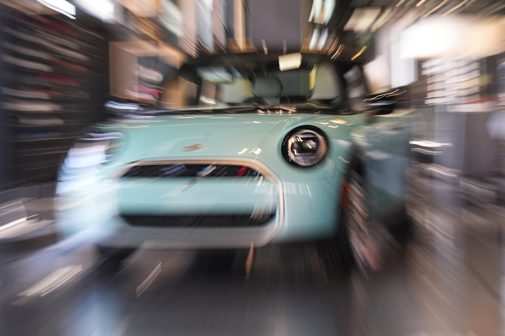 FILE - Made with a slow shutter speed and zoom lens, an unsold 2026 Cooper S hardtop is diplayed in a Mini dealership Friday, Oct. 24, 2025, in Highlands Ranch, Colo. (AP Photo/David Zalubowski, File)