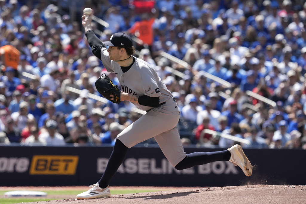 New York Yankees pitcher Cam Schlittler (31) works against the Toronto Blue Jays during the first inning of a baseball game in Toronto, Saturday, June 13, 2026. (Frank Gunn/The Canadian Press via AP)