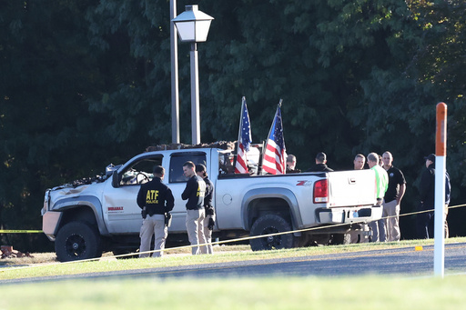 ATF police stand by the vehicle used to ram the exterior of the Church of Jesus Christ of Latter-day Saints, Monday, Sept. 29, 2025 in Grand Blanc Township, Mich. (AP Photo/Carlos Osorio) ATF police stand by the vehicle used to ram the exterior of the Church of Jesus Christ of Latter-day Saints, Monday, Sept. 29, 2025 in Grand Blanc Township, Mich. (AP Photo/Carlos Osorio)