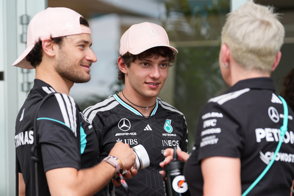Mercedes driver Andrea Kimi Antonelli, center, of Italy, talks to team members outside a hospitality tent ahead of the Formula One Miami Grand Prix auto race, Thursday, April 30, 2026, in Miami Gardens, Fla. (AP Photo/Rebecca Blackwell)