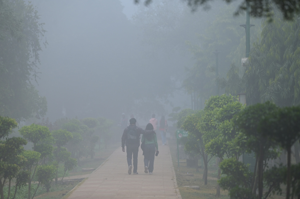 People walk through a public park in a dense smog-covered morning in New Delhi, India, Monday, Dec. 15, 2025. (AP Photo)