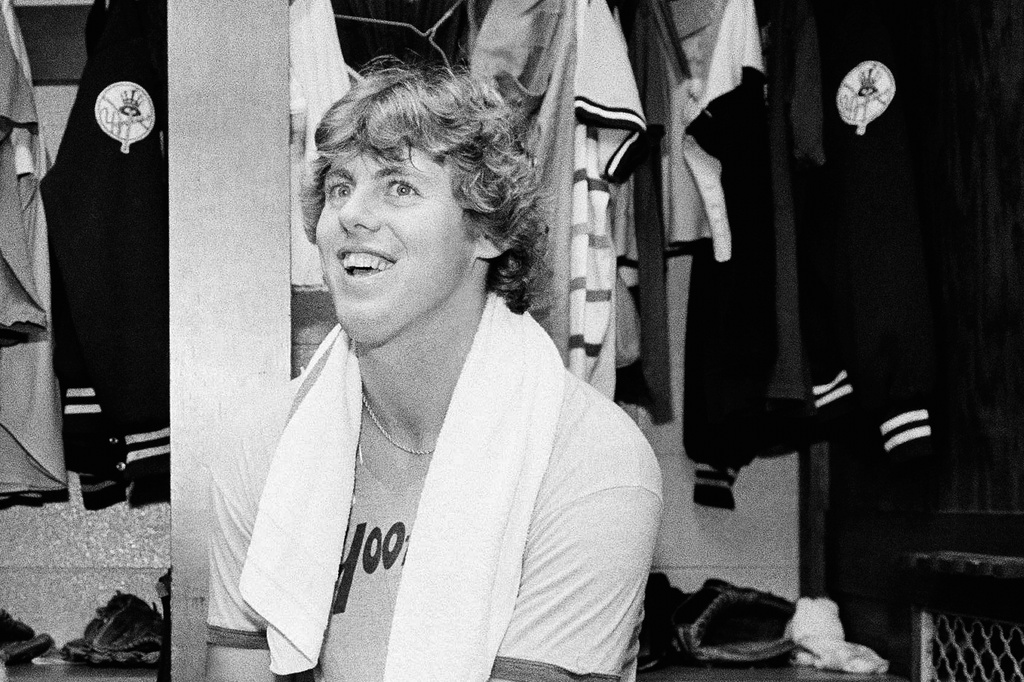 FILE - Yankee pitcher Ken Clay smiles in the dressing room after a Yankee victory over Kansas City in the American League championship opener, Oct. 3, 1978, Kansas City, Mo. (AP Photo/John Storey, file)