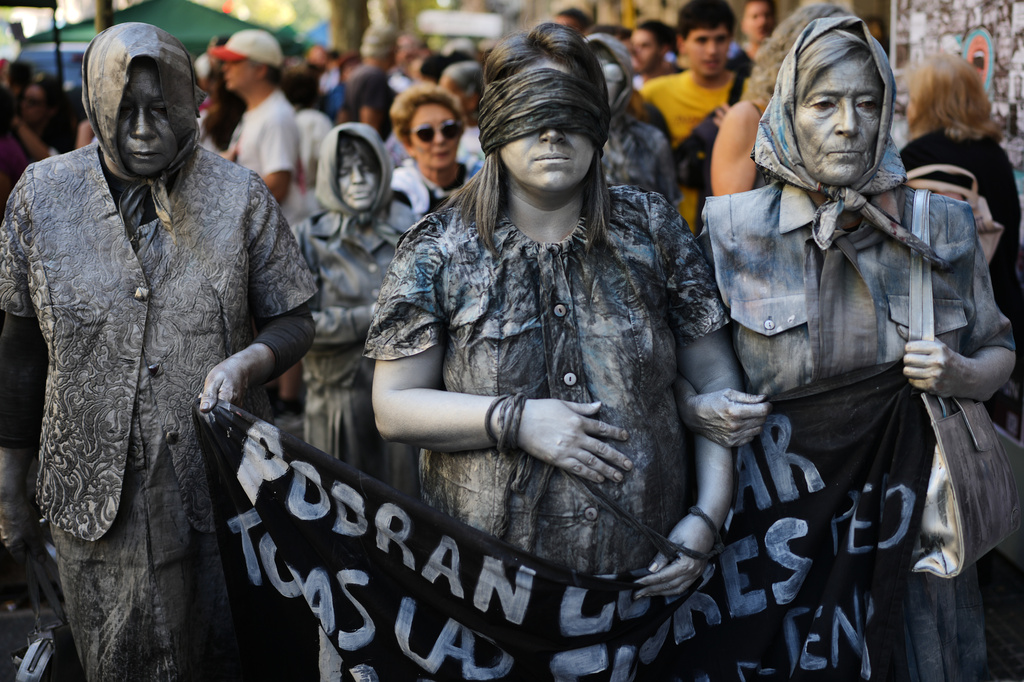 Activists demonstrate during a rally on the anniversary of the coup that brought the military regime (1976-1983) to power, in Buenos Aires, Argentina, Tuesday, March 24, 2026. (AP Photo/Rodrigo Abd)
