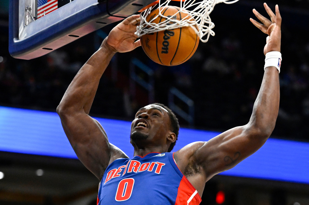 Detroit Pistons center Jalen Duren (0) dunks the ball during the second half of an NBA basketball game against the Washington Wizards, Tuesday, March 17, 2026, in Washington. (AP Photo/John McDonnell)