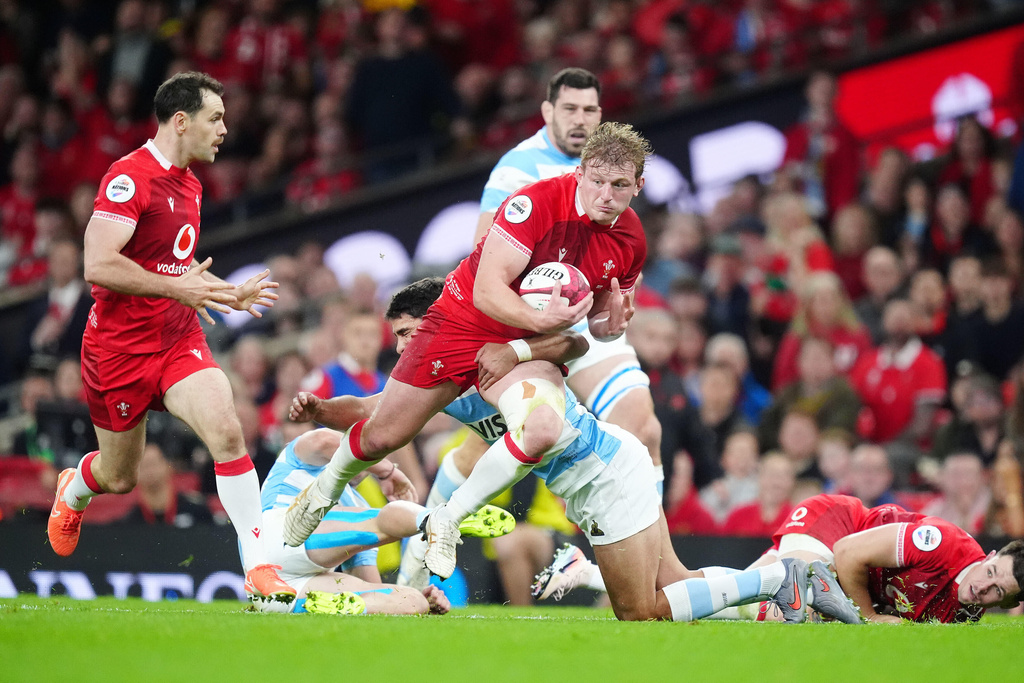 Wales' Jac Morgan passes the ball to Tomos Williams who runs in to score a try during the Quilter Nations Series rugby match between Wales and Argentina in Cardiff, Wales, Sunday, Nov. 9, 2025. (David Davies/PA via AP)