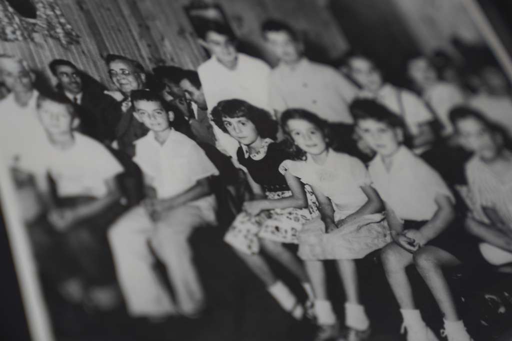 An old photo shows Fatima Igram Smejkal sitting with children whose families had immigrated to the United States from present-day Lebanon in the early 1900s, on Friday, Aug. 8, 2025, in Cedar Rapids, Iowa. (AP Photo/Jessie Wardarski)