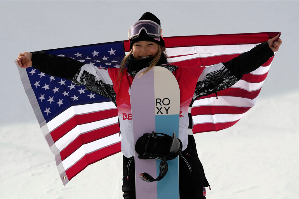 FILE - United States' Chloe Kim celebrates during the venue ceremony for the women's halfpipe at the 2022 Winter Olympics, Feb. 10, 2022, in Zhangjiakou, China. (AP Photo/Francisco Seco, File)