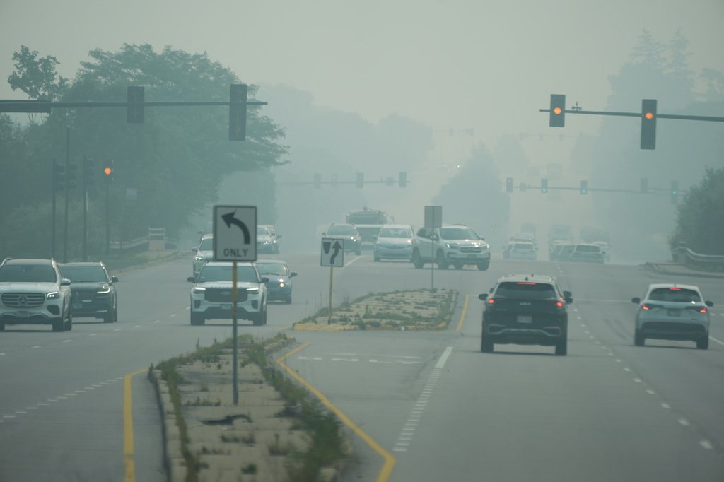 A general view of a street in Northbrook, Ill., during poor air quality due to dense smoke from Canadian wildfires in Northbrook, Ill., Thursday, July 16, 2026. (AP Photo/Nam Y. Huh)