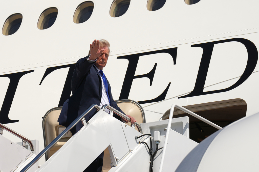 President Donald Trump boards Air Force One after an emergency inflatable slide deployed before he arrived at Joint Base Andrews, Md., Wednesday, Sept. 9, 2026. (AP Photo/Jacquelyn Martin)