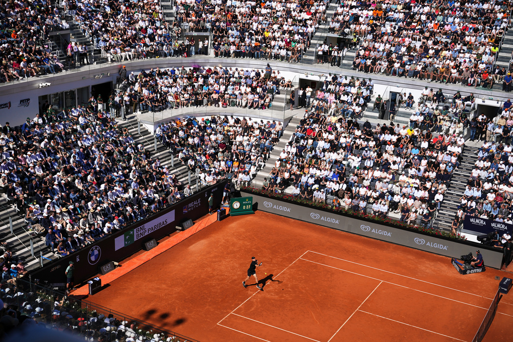 Italy's Jannik Sinner strikes a forehand to Australia's Alexei Popyrin, during their match at the Italian Open tennis tournament in Rome, Monday, May 11, 2026. (AP Photo/Alessandra Tarantino)