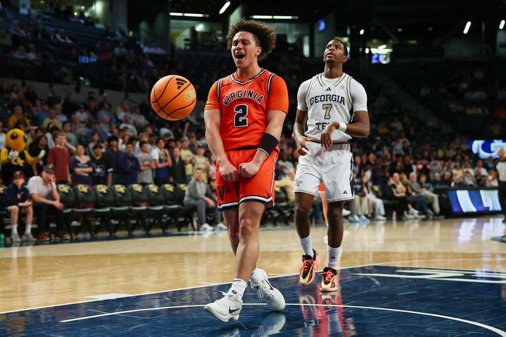 FILE - Virginia guard Chance Mallory (2) and Georgia Tech guard Chas Kelley III (7) react during the first half of an NCAA college basketball game in Atlanta, Feb. 18, 2026. (AP Photo/Colin Hubbard, File)
