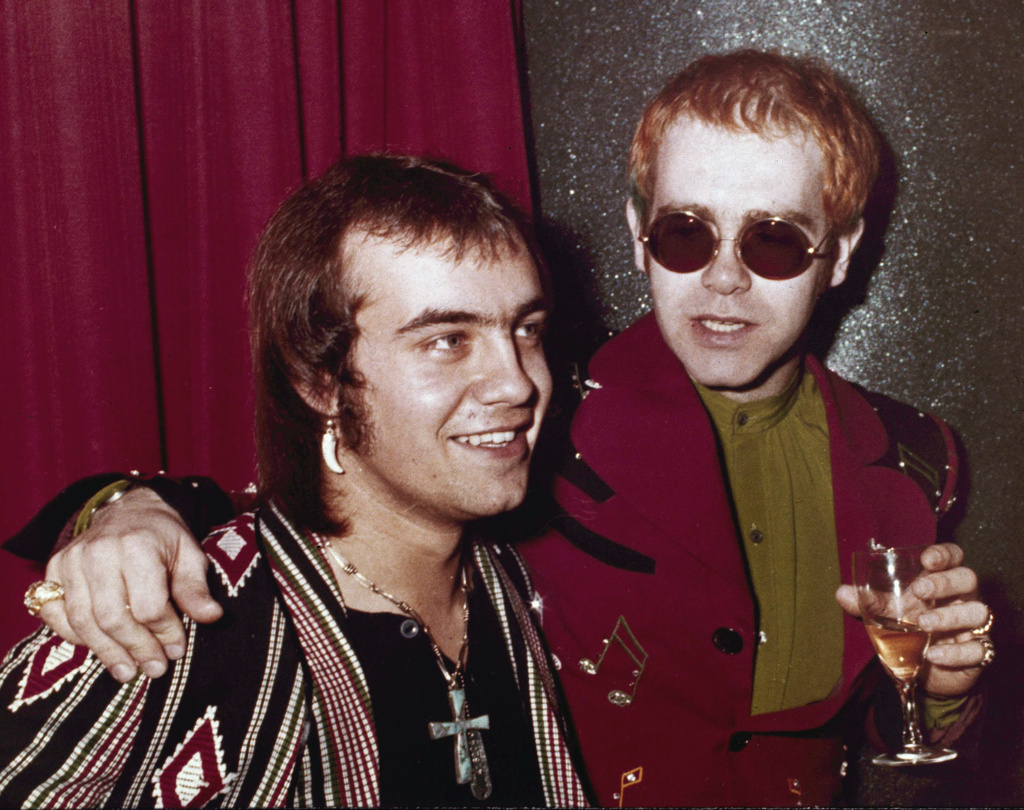 FILE - British pop idol Elton John, right, appears with his lyricist Bernie Taupin in London on March 5, 1973. (AP Photo/John Glanvill, File)