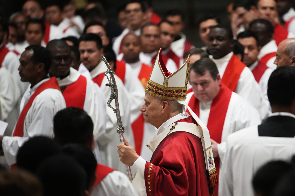 Pope Leo XIV arrives to celebrate a Mass for the opening of the academic year of the Pontifical University and for the Jubilee of the Educational World in St. Peter's Basilica at the Vatican, Monday, Oct. 27, 2025.(AP Photo/Alessandra Tarantino)