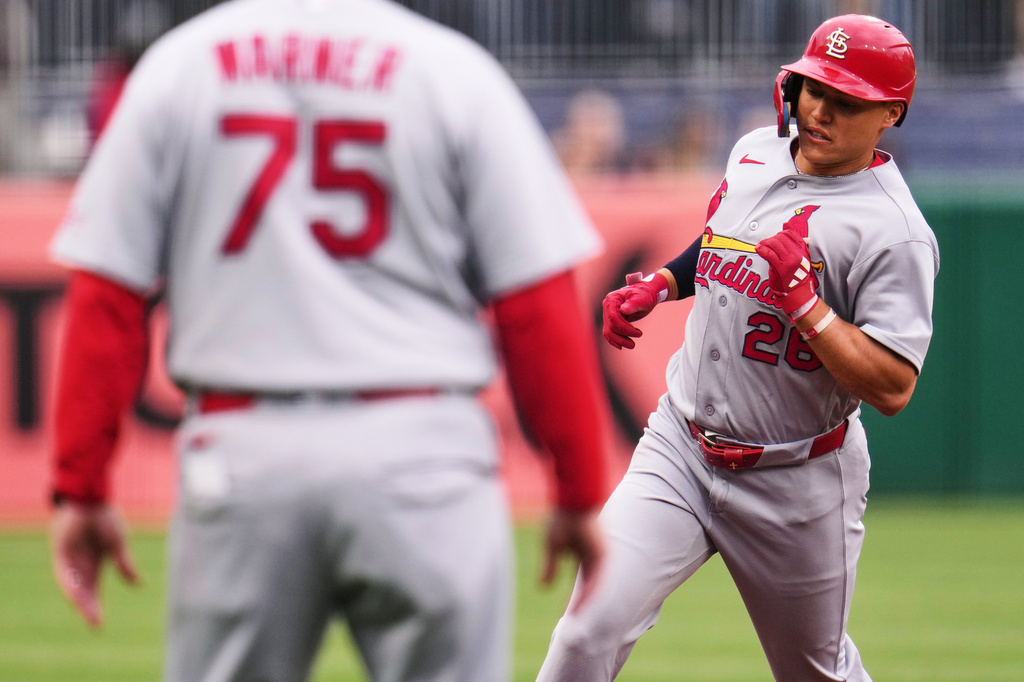 St. Louis Cardinals' JJ Wetherholt (26) rounds third past third base coach Ron 'pop' Warner (75) after leading off the baseball game with a solo home run off Pittsburgh Pirates pitcher Paul Skenes during the first inning in Pittsburgh, Thursday, April 30, 2026. (AP Photo/Gene J. Puskar)