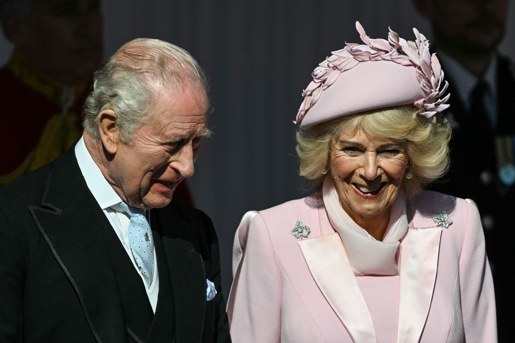 Britain's King Charles and Queen Camilla wait at Datchet Road to greet Nigerian President Bola Ahmed Tinubu, and his wife ahead of a carriage procession to Windsor Castle, in Windsor, England, Wednesday, March 18, 2026. (Justin Tallis/Pool Photo via AP)
