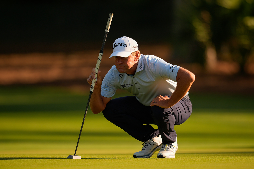 FILE - Lucas Glover lines up his putt on the second green during the first round at the RBC Heritage golf tournament, April 16, 2026, in Hilton Head Island, S.C. (AP Photo/Mike Stewart, File)