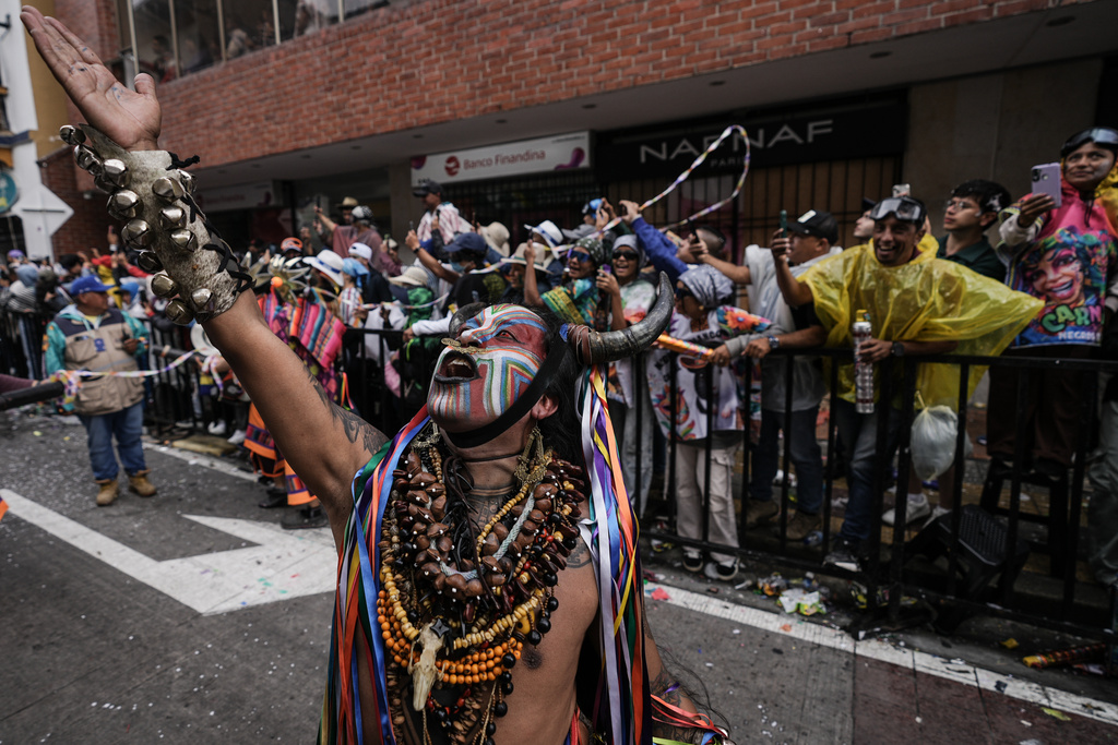 A reveler gestures during the Black and White Carnival, recognized by UNESCO as Intangible Cultural Heritage, in Pasto, Colombia, Tuesday, Jan. 6, 2026. (AP Photo/Ivan Valencia)