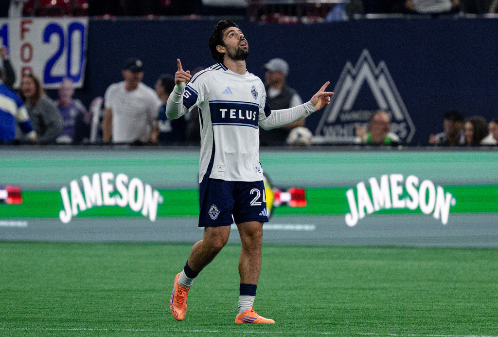Vancouver Whitecaps' Brian White (24) celebrates after scoring against DC United during the first half of an MLS soccer match in Vancouver, British Columbia, Saturday, Sept. 26, 2026. (Jacob Mallari/The Canadian Press via AP)