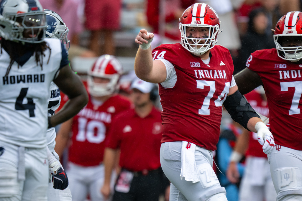 Indiana offensive lineman Bray Lynch (74) gestures toward a Howard player after the player made helmet-to-helmet contact with Indiana quarterback Josh Hoover (10) during the first half of an NCAA college football game, Saturday, Sept. 12, 2026, in Bloomington, Ind. (AP Photo/Doug McSchooler)
