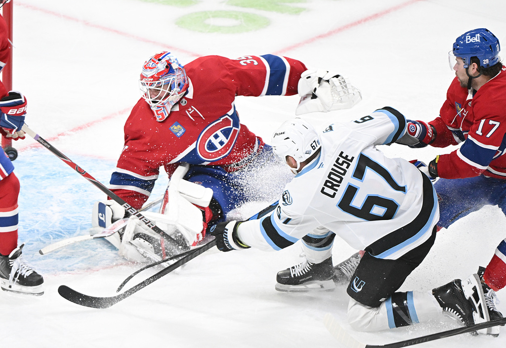 Utah Mammoth's Lawson Crouse (67) scores against Montreal Canadiens goaltender Sam Montembeault during second period NHL hockey action in Montreal, Saturday, Nov. 8, 2025. (Graham Hughes/The Canadian Press via AP)