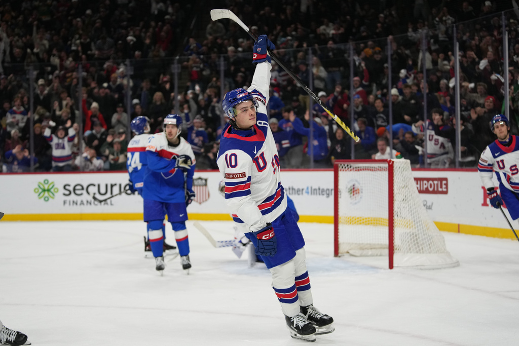 United States forward James Hagens (10) celebrates after scoring during the second period of an IIHF World Junior Hockey Championship game against Slovakia, Monday, Dec. 29, 2025, in St. Paul, Minn. (AP Photo/Abbie Parr)
