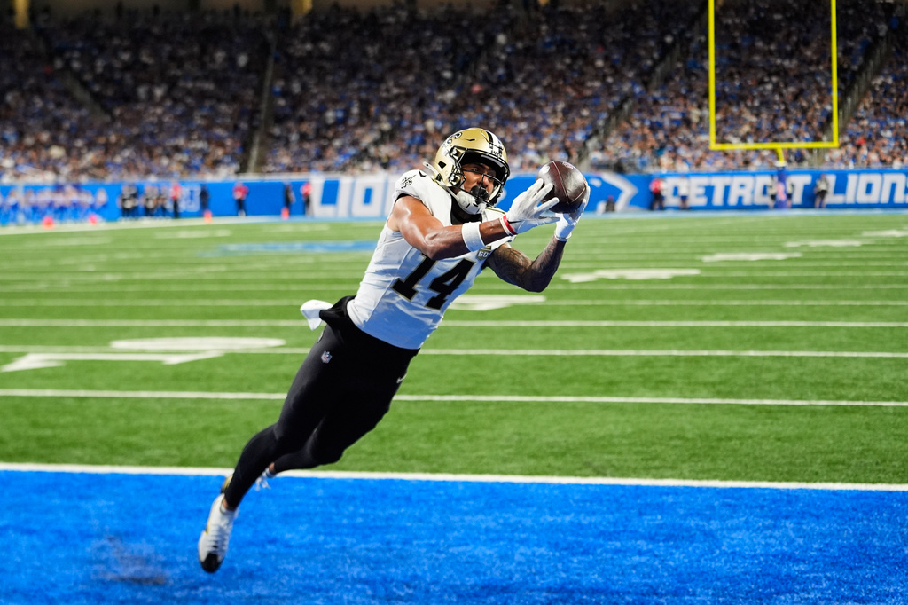 New Orleans Saints wide receiver Devaughn Vele (14) pulls in a touchdown reception against the Detroit Lions in the second half of an NFL football game, Sunday, Sept. 13, 2026, in Detroit. (AP Photo/Paul Sancya)