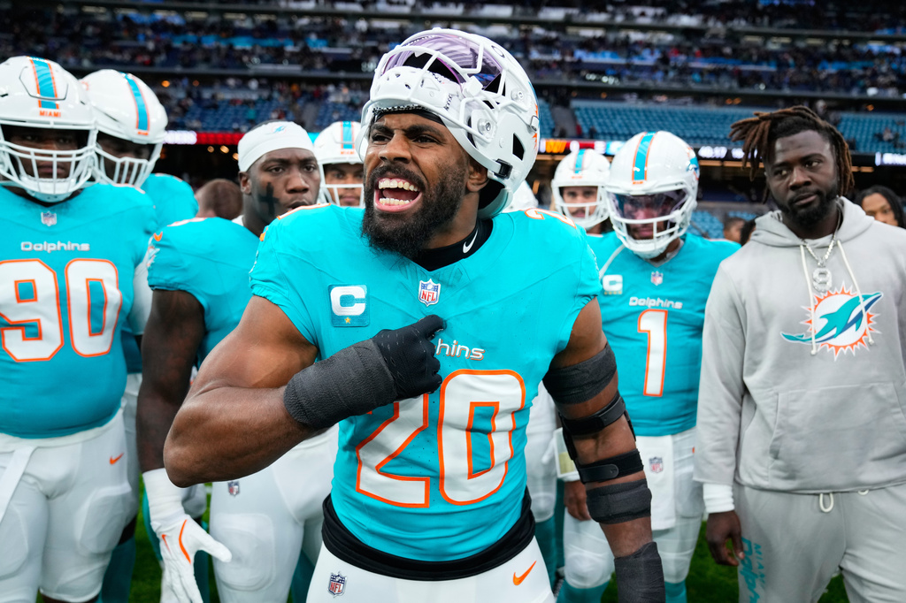 FILE - Miami Dolphins linebacker Jordyn Brooks (20) reacts as he warms-up before an NFL football game between the Washington Commanders and the Miami Dolphins in Madrid, Spain, Nov. 16, 2025. (AP Photo/Manu Fernandez, File)